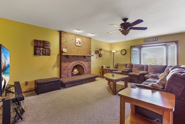 carpeted living room featuring ceiling fan and a brick fireplace