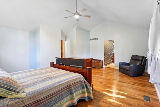 bedroom featuring ceiling fan, lofted ceiling, and hardwood / wood-style floors