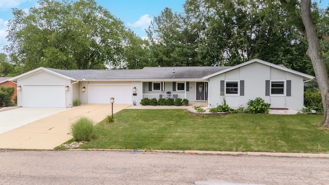 single story home featuring a garage and a front yard