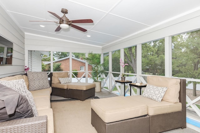 sunroom / solarium featuring vaulted ceiling, a wealth of natural light, and ceiling fan