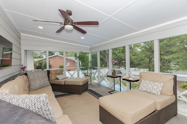 sunroom with vaulted ceiling, ceiling fan, and a wealth of natural light