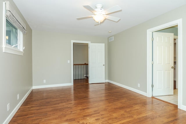 unfurnished bedroom featuring ceiling fan and hardwood / wood-style floors