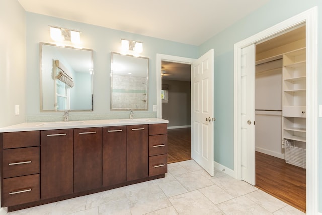 bathroom with tile patterned flooring and double sink vanity