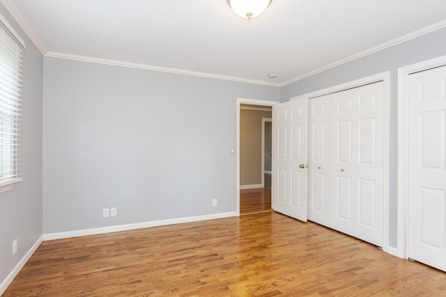 unfurnished bedroom featuring light hardwood / wood-style floors and ornamental molding