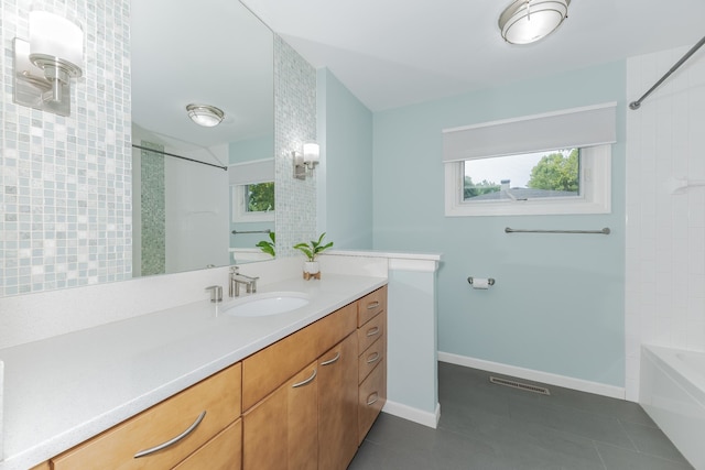 bathroom featuring tile patterned floors, shower / washtub combination, and vanity