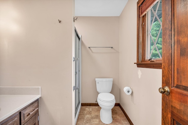 bathroom featuring vanity, toilet, and tile patterned floors