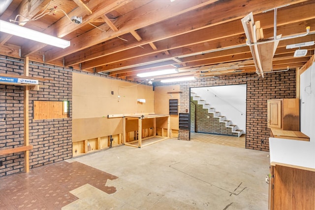 basement with brick wall