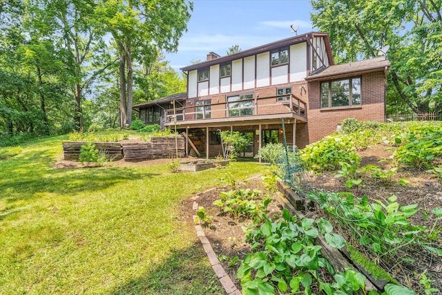 back of house with a deck and a lawn