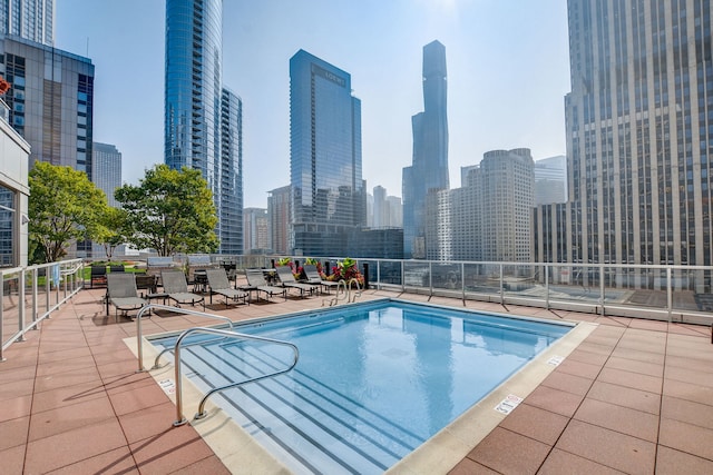 view of swimming pool with a patio area