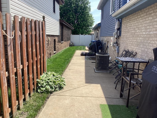 view of patio / terrace featuring fence private yard and cooling unit