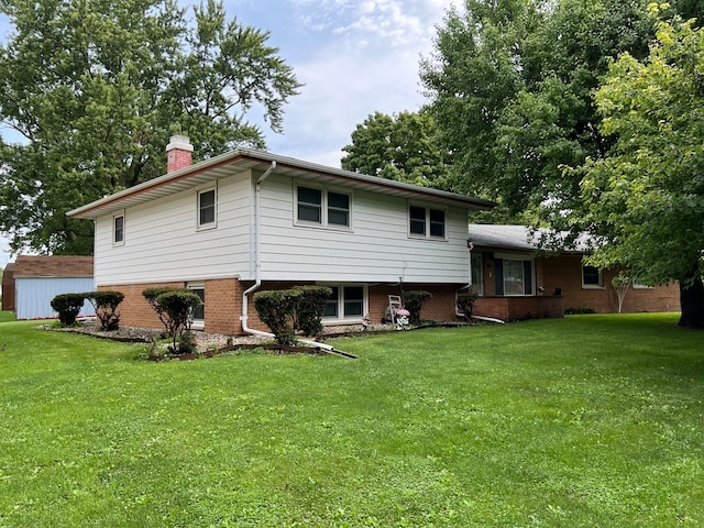 back of property with a yard and a shed