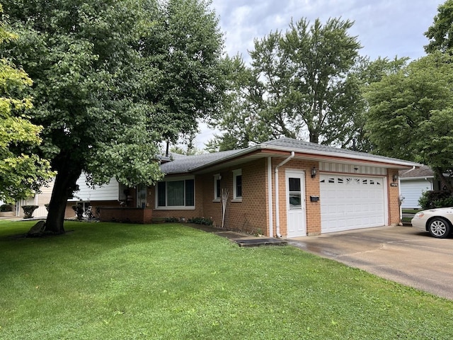 view of property exterior with an attached garage, driveway, a lawn, and brick siding