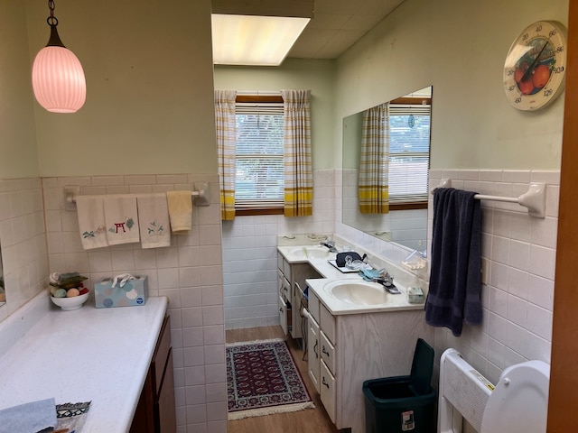 bathroom featuring tile walls and plenty of natural light