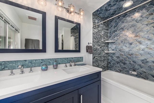 bathroom with shower / tub combo with curtain and vanity