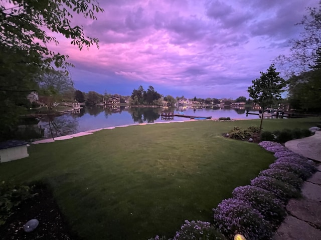 yard at dusk with a water view