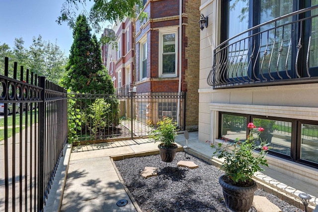 938 N Washtenaw Ave, Chicago, IL 60622 - doorway to property featuring fence and brick siding