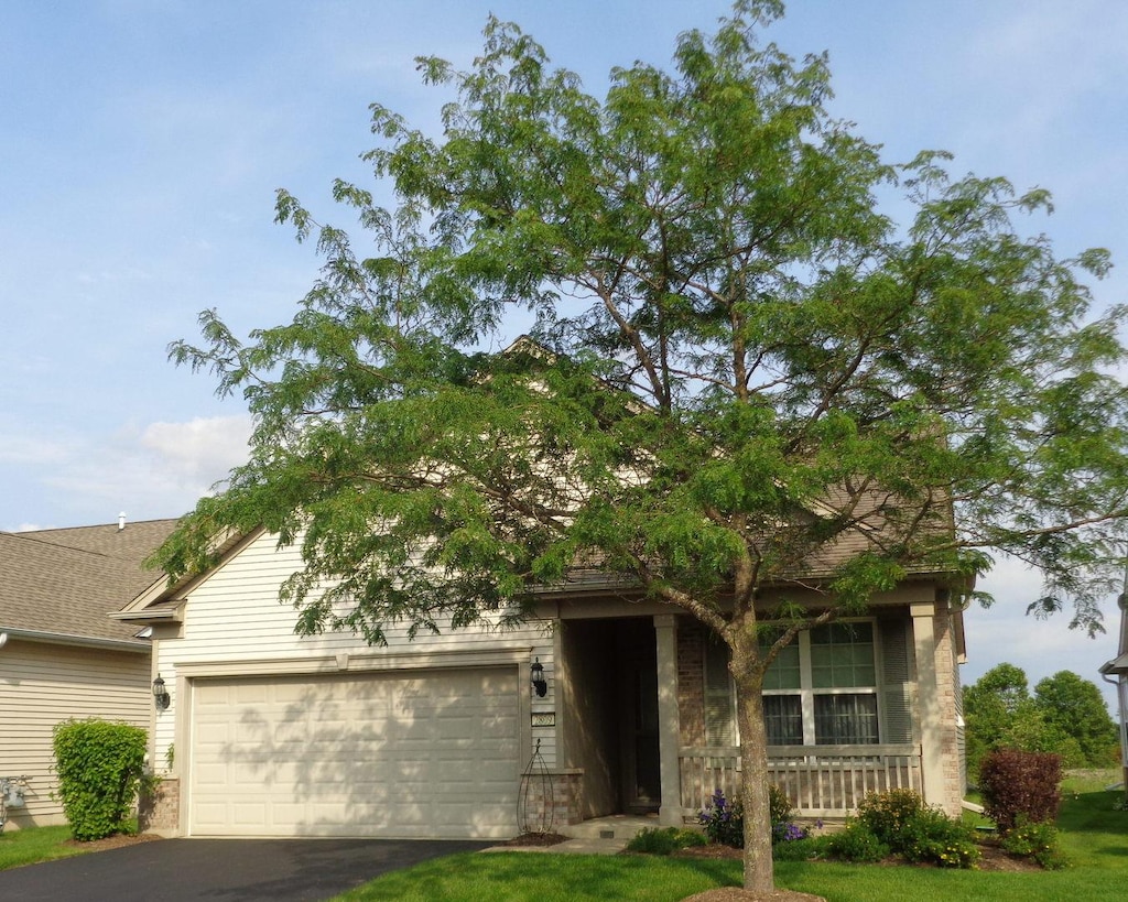 view of front of house featuring a garage and covered porch