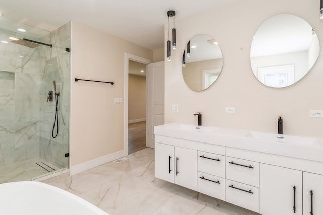 bathroom with walk in shower and vanity