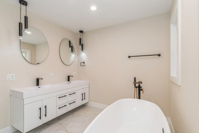 bathroom with vanity and a bathing tub