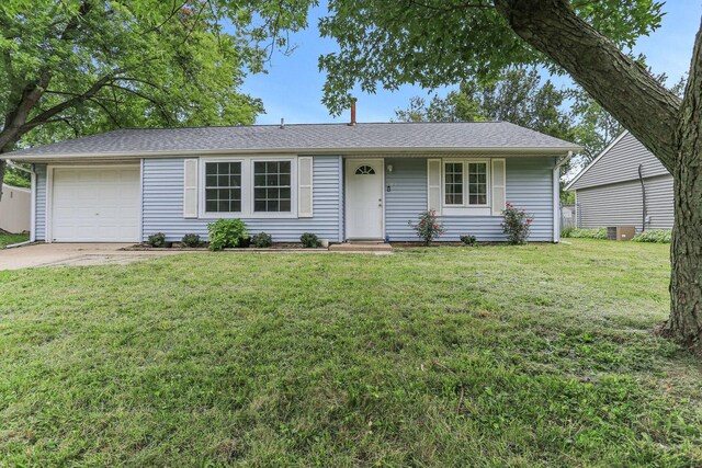 single story home featuring a front lawn and a garage