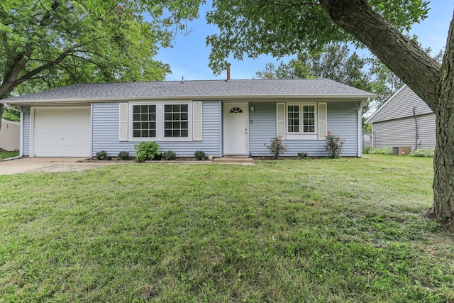 ranch-style home with a garage and a front lawn