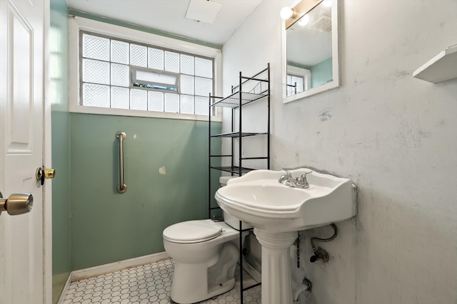 bathroom with tile patterned floors and toilet