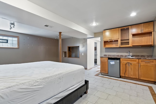 tiled bedroom featuring sink