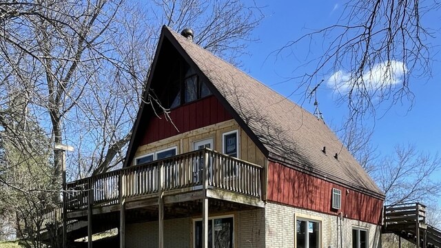 view of home's exterior featuring a wooden deck