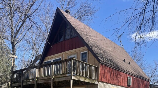 view of home's exterior featuring a deck