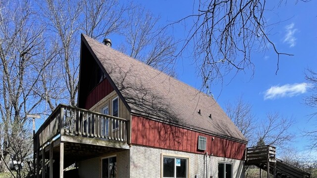 view of side of home featuring a deck