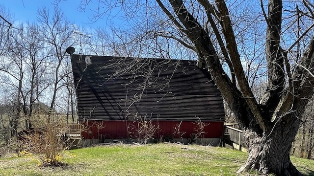 view of property exterior featuring a lawn