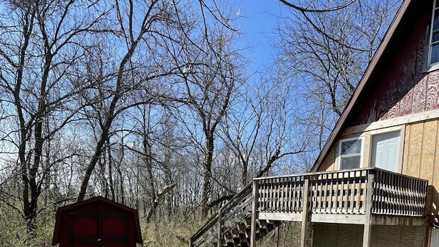 view of home's exterior with a wooden deck