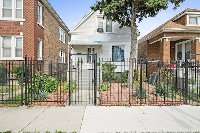 6821 S Campbell Ave, Chicago, IL 60629 - view of front of property with a fenced front yard, a gate, and brick siding