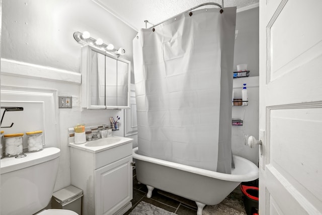 full bathroom featuring a textured ceiling, toilet, tile patterned floors, vanity, and ornamental molding