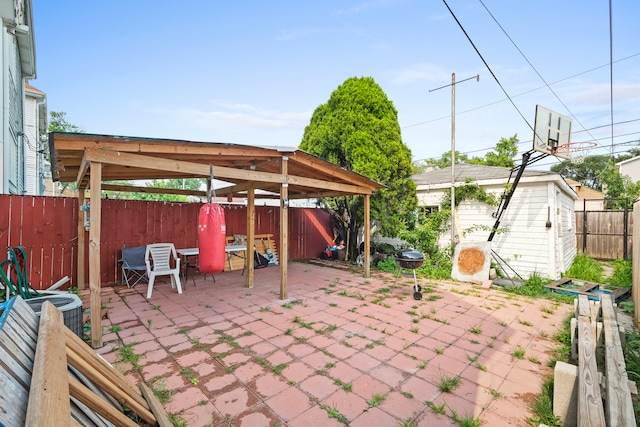 view of patio / terrace featuring a storage unit