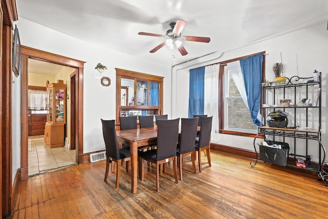 6821 S Campbell Ave, Chicago, IL 60629 - dining room with wood-type flooring, a ceiling fan, and baseboards