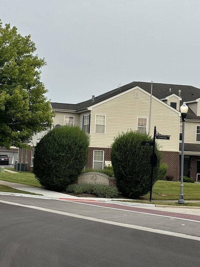 view of side of home with cooling unit