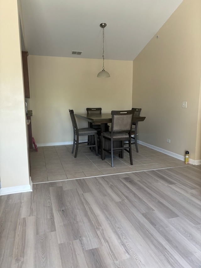 dining area with wood-type flooring