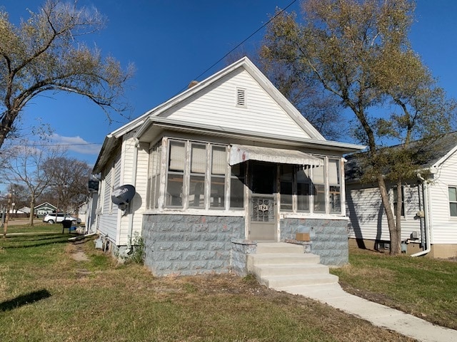 bungalow with a front lawn