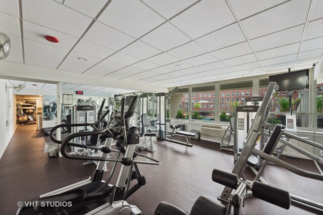 exercise room featuring a drop ceiling