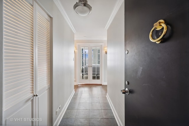 hallway with light tile patterned flooring, french doors, and crown molding