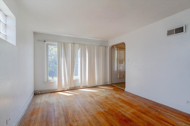 unfurnished room with light hardwood / wood-style flooring