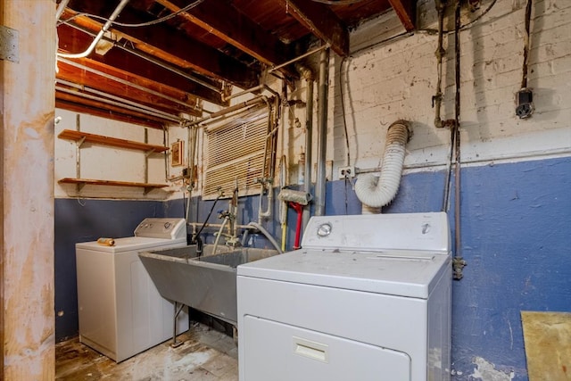 laundry area with washing machine and clothes dryer