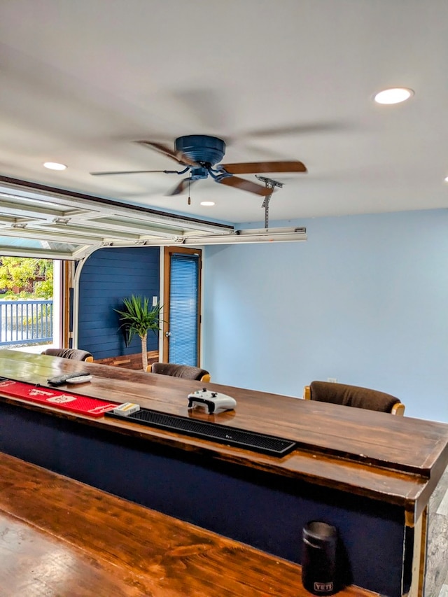 dining room with ceiling fan and hardwood / wood-style floors