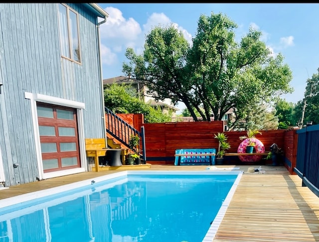 view of pool featuring a wooden deck