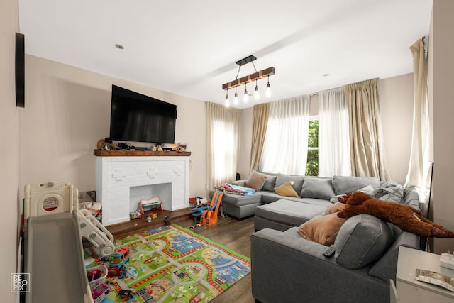 living room featuring a fireplace and dark wood-type flooring