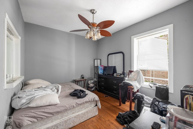 bedroom featuring wood-type flooring and ceiling fan