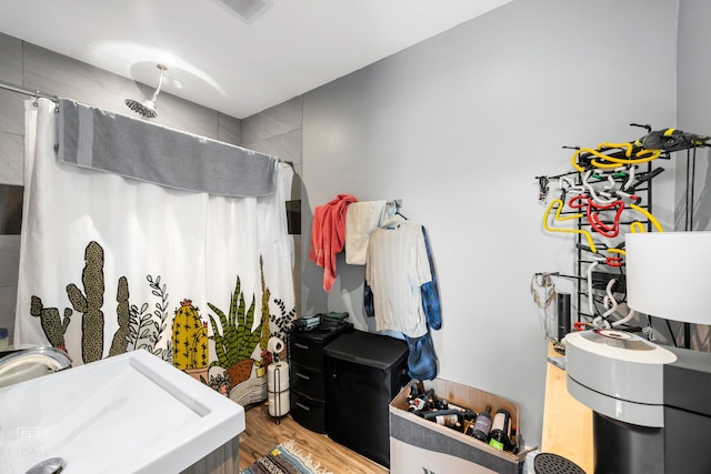 bathroom featuring sink and hardwood / wood-style floors