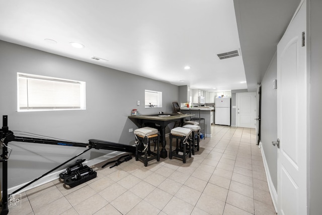 tiled dining area featuring a wealth of natural light