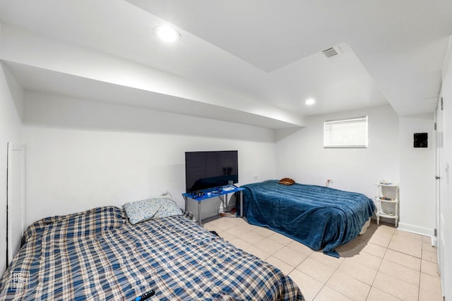 bedroom with light tile patterned flooring